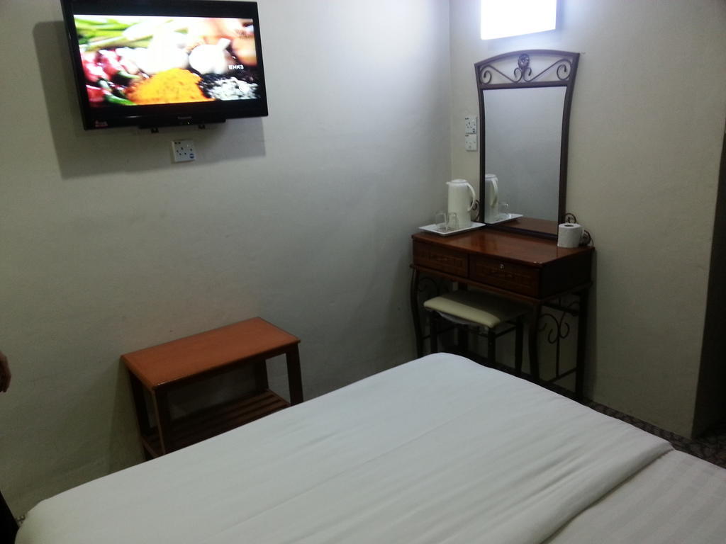 Oriental Inn Κουτσίνγκ Δωμάτιο φωτογραφία