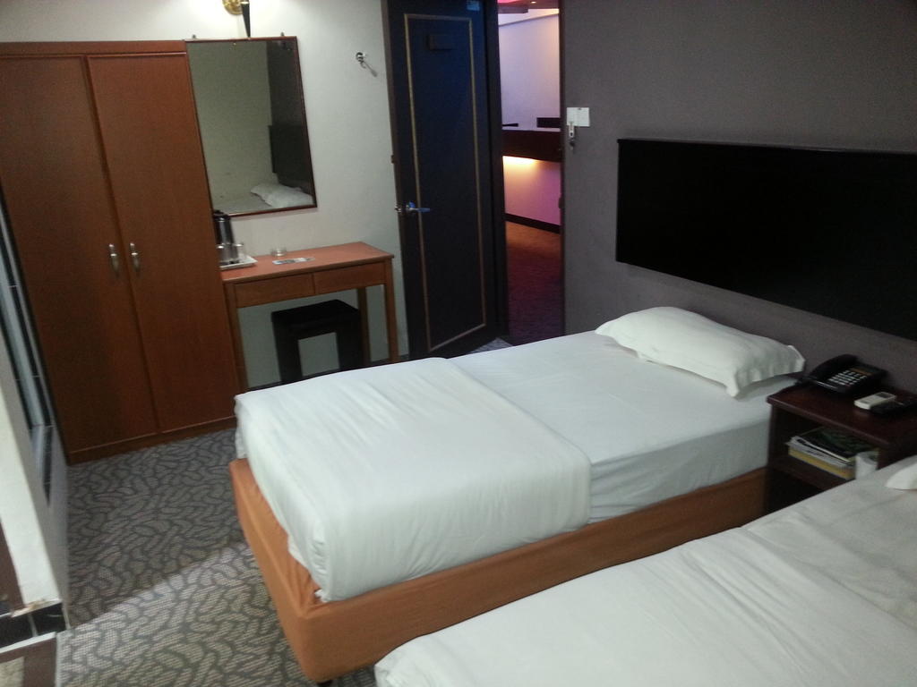 Oriental Inn Κουτσίνγκ Δωμάτιο φωτογραφία