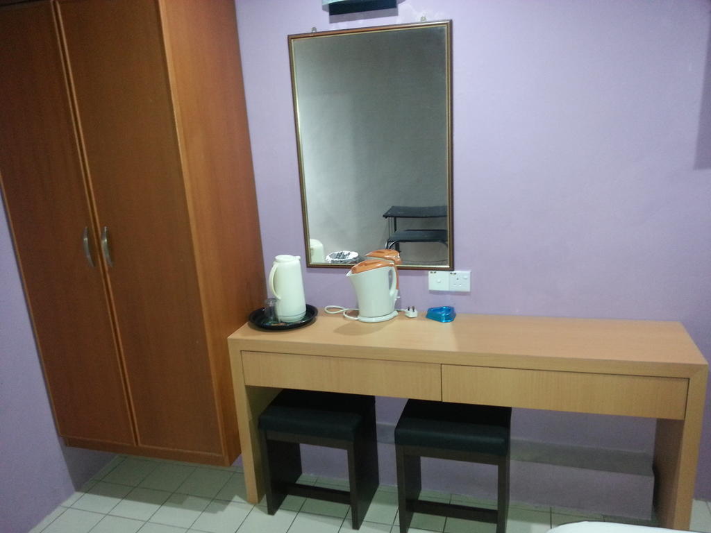 Oriental Inn Κουτσίνγκ Δωμάτιο φωτογραφία
